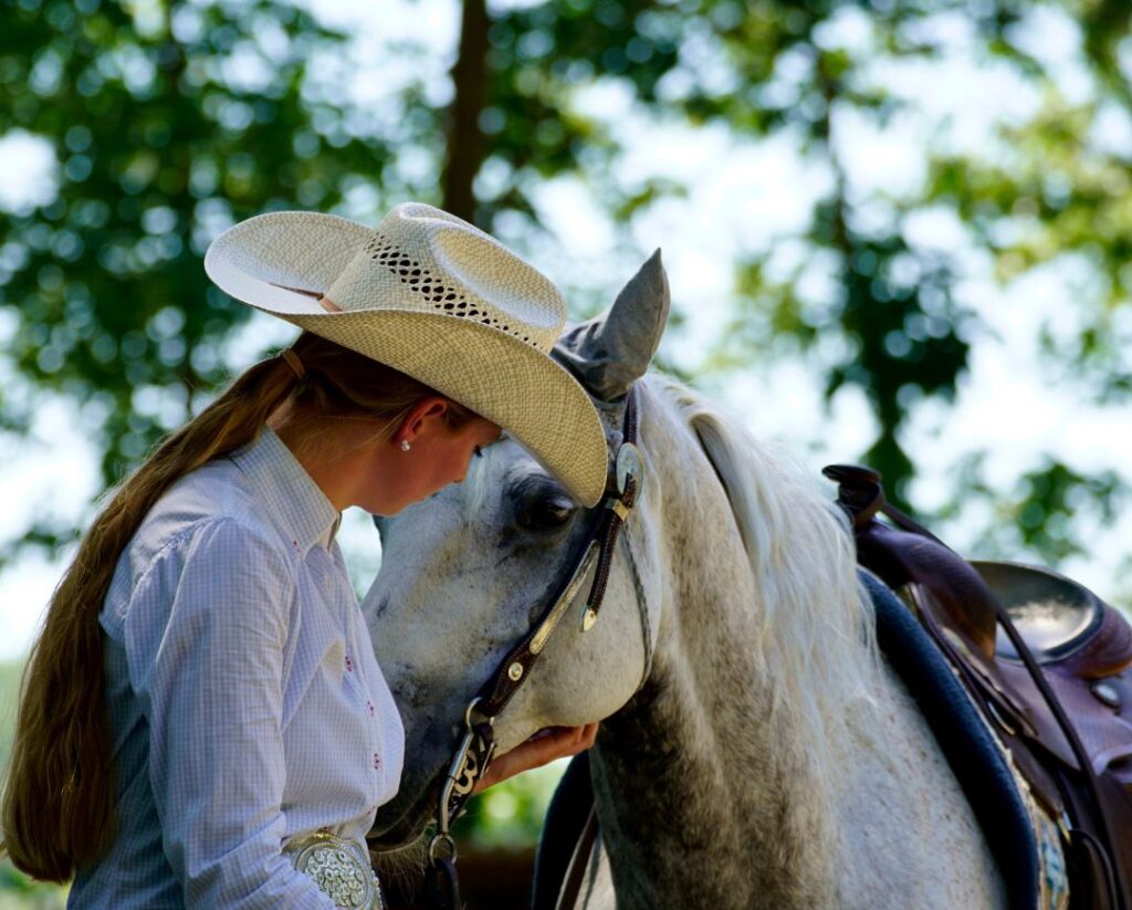 cowgirl and horse at horse show